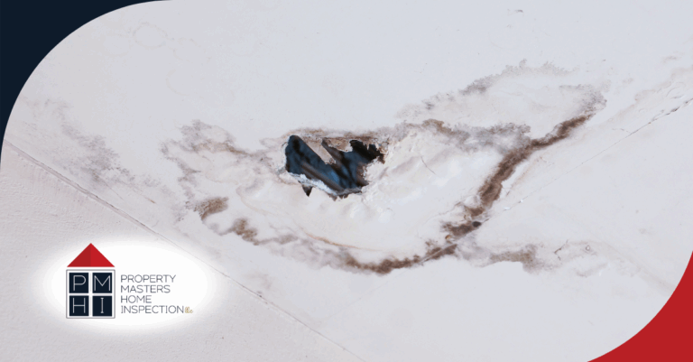 Severe ceiling damage with mold and a large hole from a water leak.