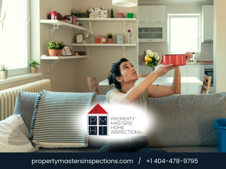 Homeowner catching ceiling leak water in living room.